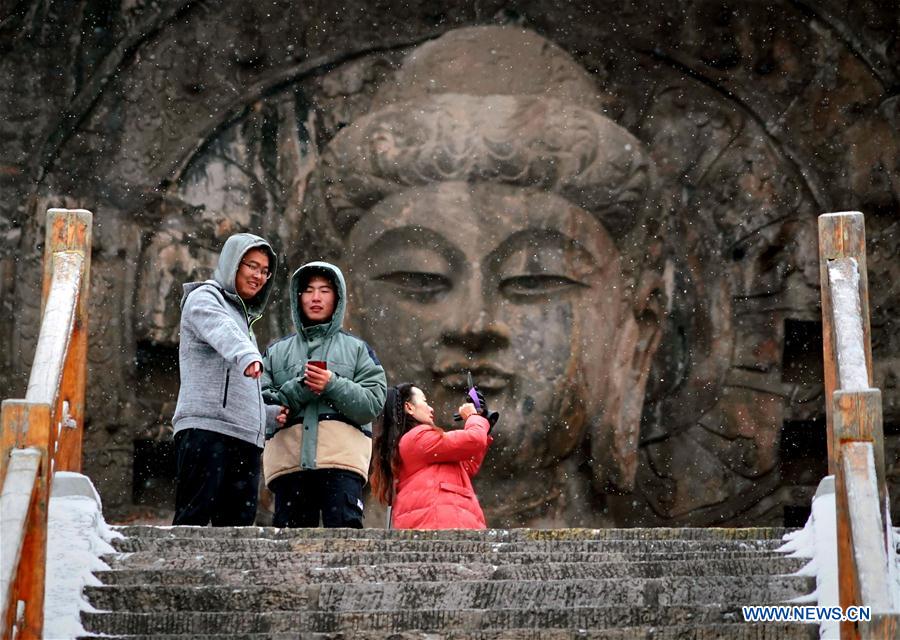 In pics: snow-covered Longmen Grottoes in Luoyang, C China's Henan