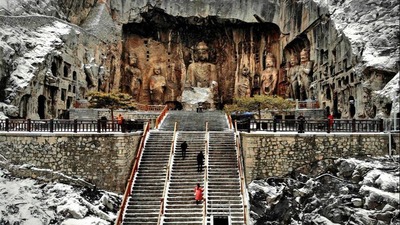 In pics: snow-covered Longmen Grottoes in Luoyang, C China's Henan