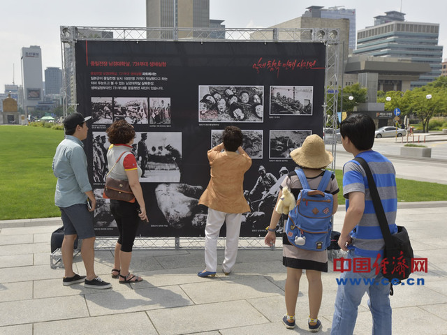 百余张抗战历史图片首尔展出 韩国老人讲述日军罪行