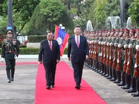 习近平同老挝人民革命党中央委员会总书记、国家主席本扬举行会谈